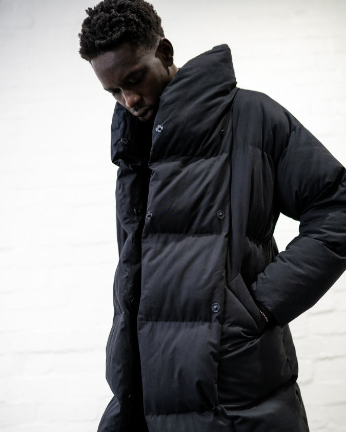 Australian black longline puffer jacket worn by male model