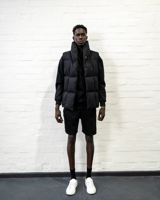 Australian Black Longline Puffer Vest worn by male model full body front view