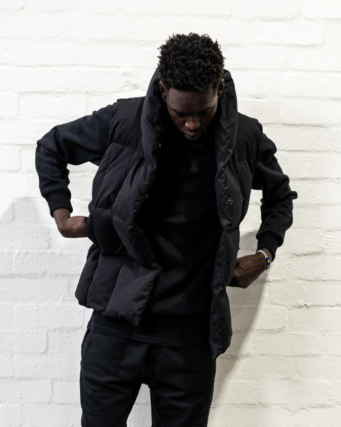 Black Long Puffer Vest worn by male model