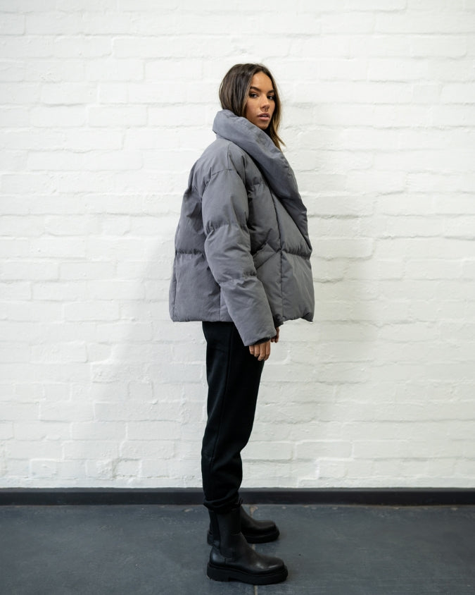 Australian Charcoal puffer jacket worn by female model full body side view