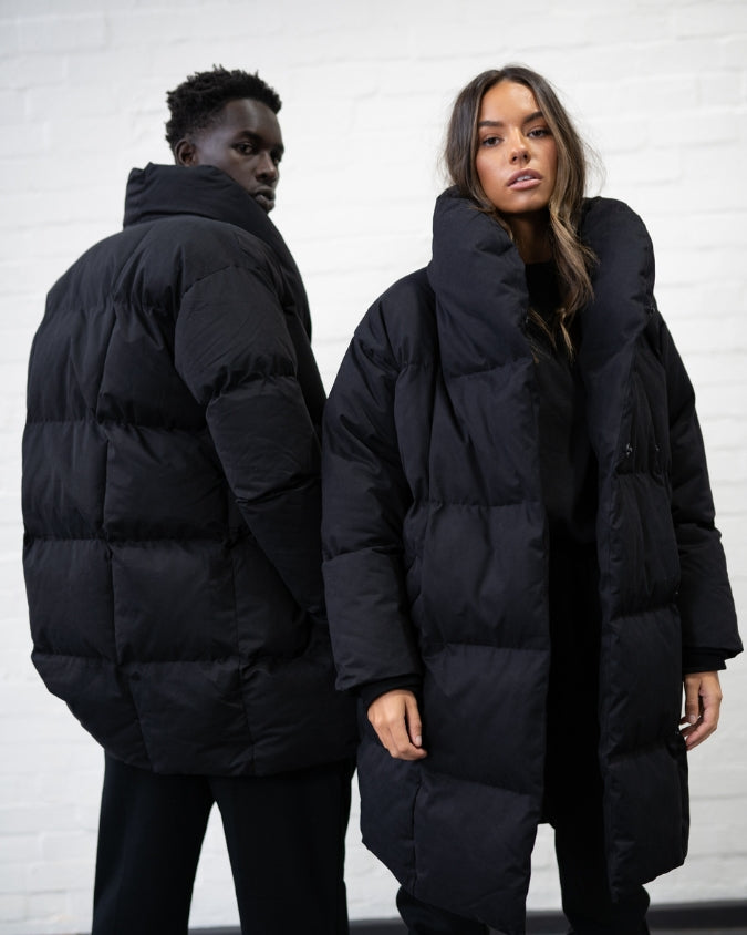 Male and female model wearing australian black puffer jacket