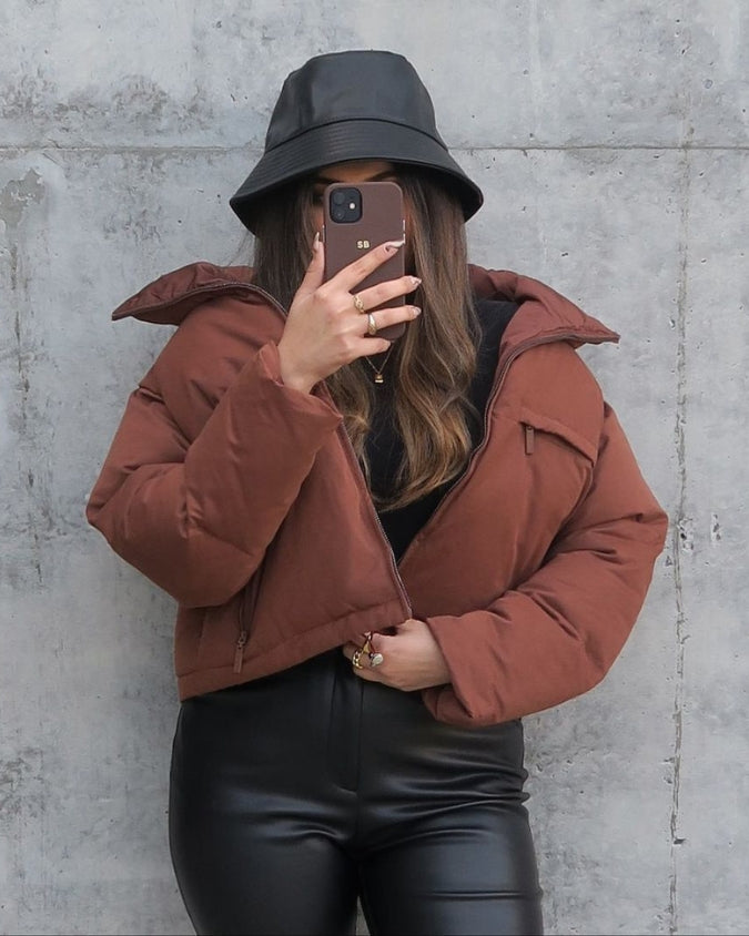 Cleaned Chocolate cropped puffer jacket worn with bucket hat and accessories