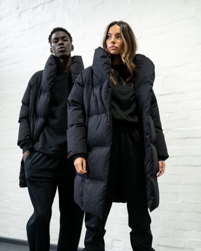 Male and female model wearing australian black longline puffer jacket