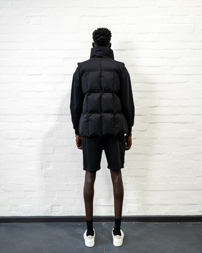 Australian Black Longline Puffer Vest worn by male model full body back view