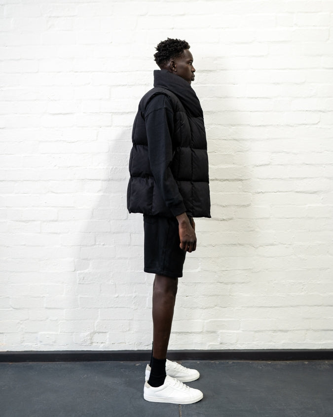 Australian Black Longline Puffer Vest worn by male model full body side view