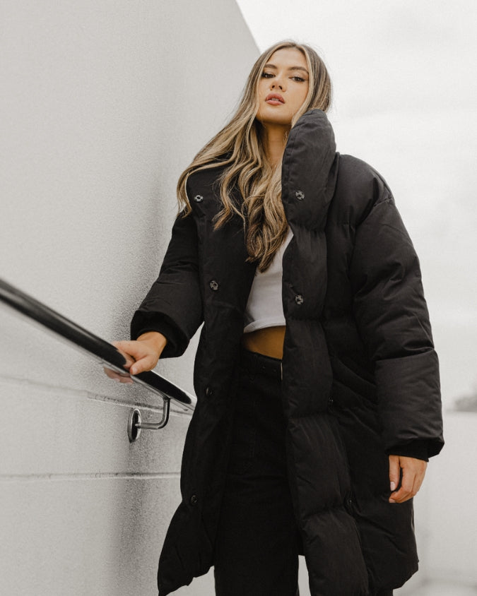 Australian black longline puffer jacket worn by female model