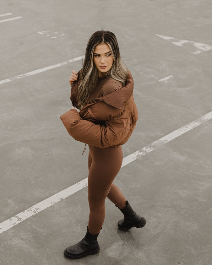 Australian womens Chocolate cropped puffer jacket worn by female model