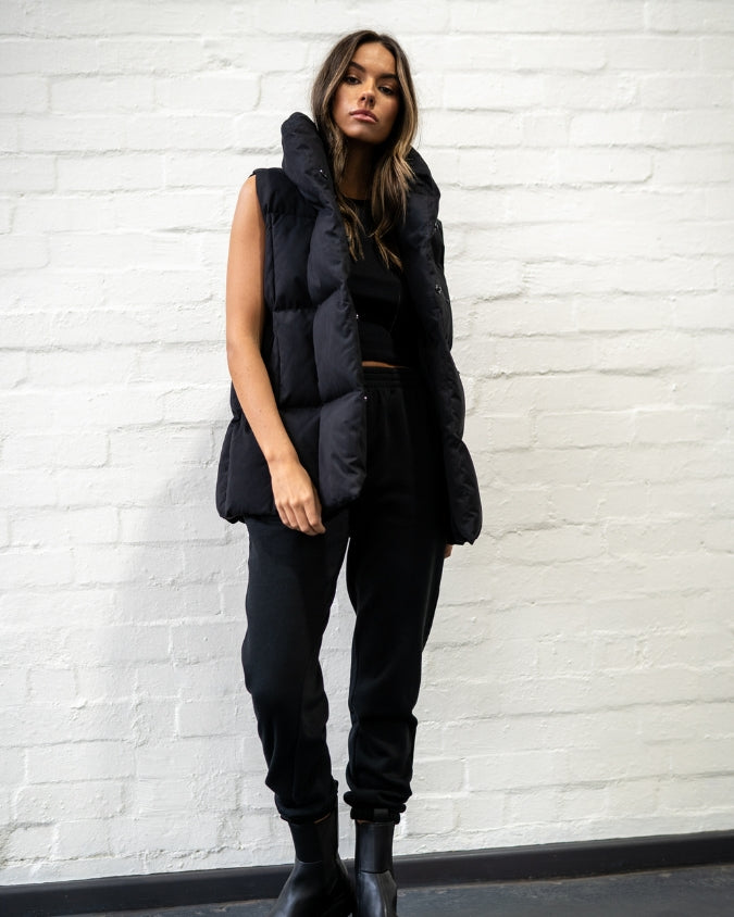 Australian Black Long Puffer Vest worn by female model full body front view