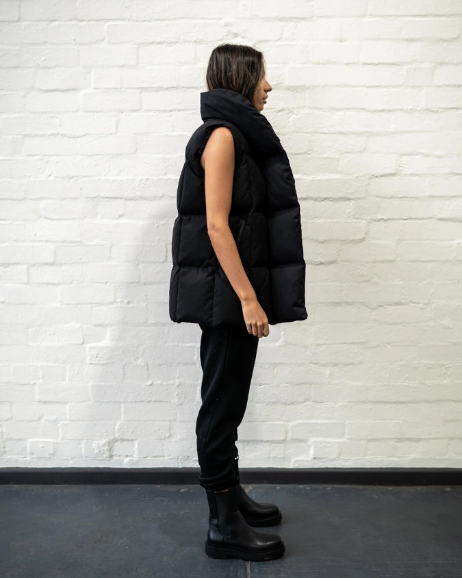 Australian Black Longline Puffer Vest worn by female model full body side view