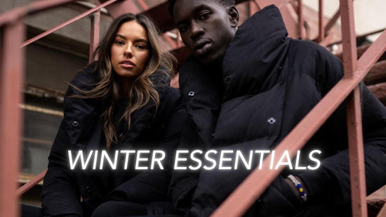 Unisex puffer jacket winter essential worn by male and female model with 